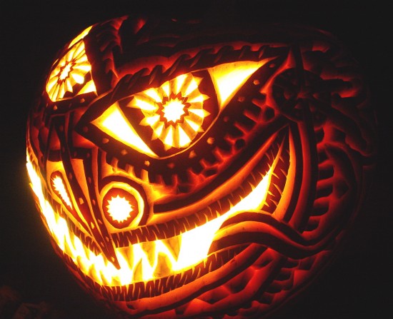 pumpkin carved with dream catcher face